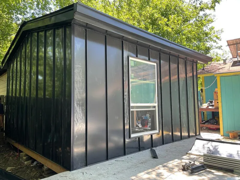 Black standing seam metal wall panels for Roof Inspection in Lely Resort