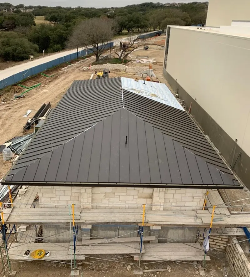 Metal roof new construction with scaffolding in Lely Resort